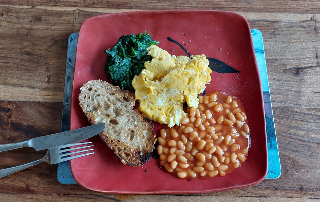 Photo of scrambled eggs, spinach and baked beans with wholemeal toast